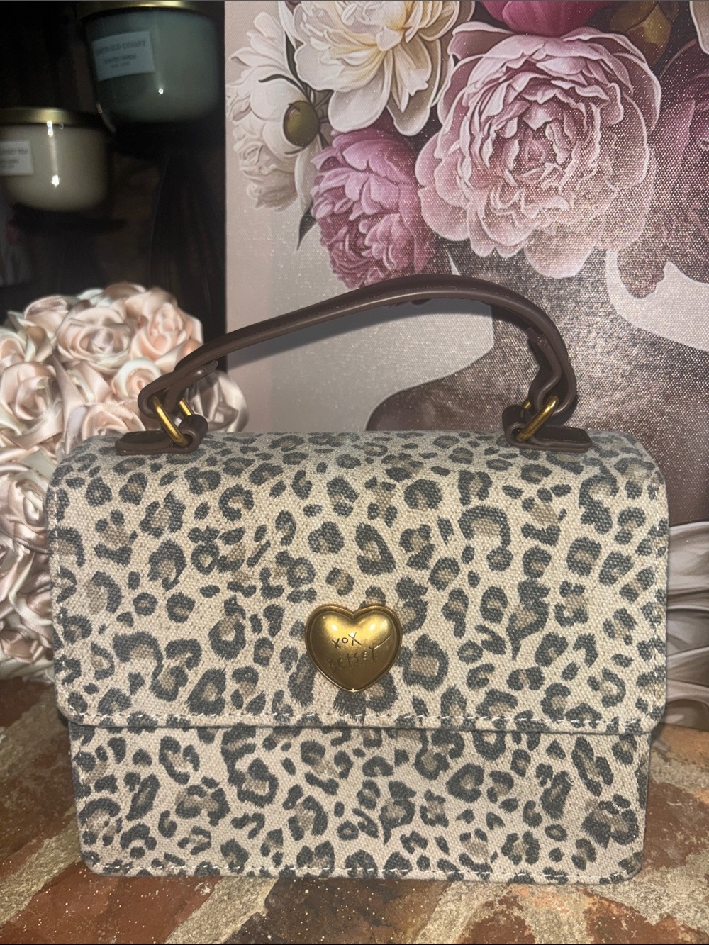 Betsey John’s Leopard Print top handle handbag.